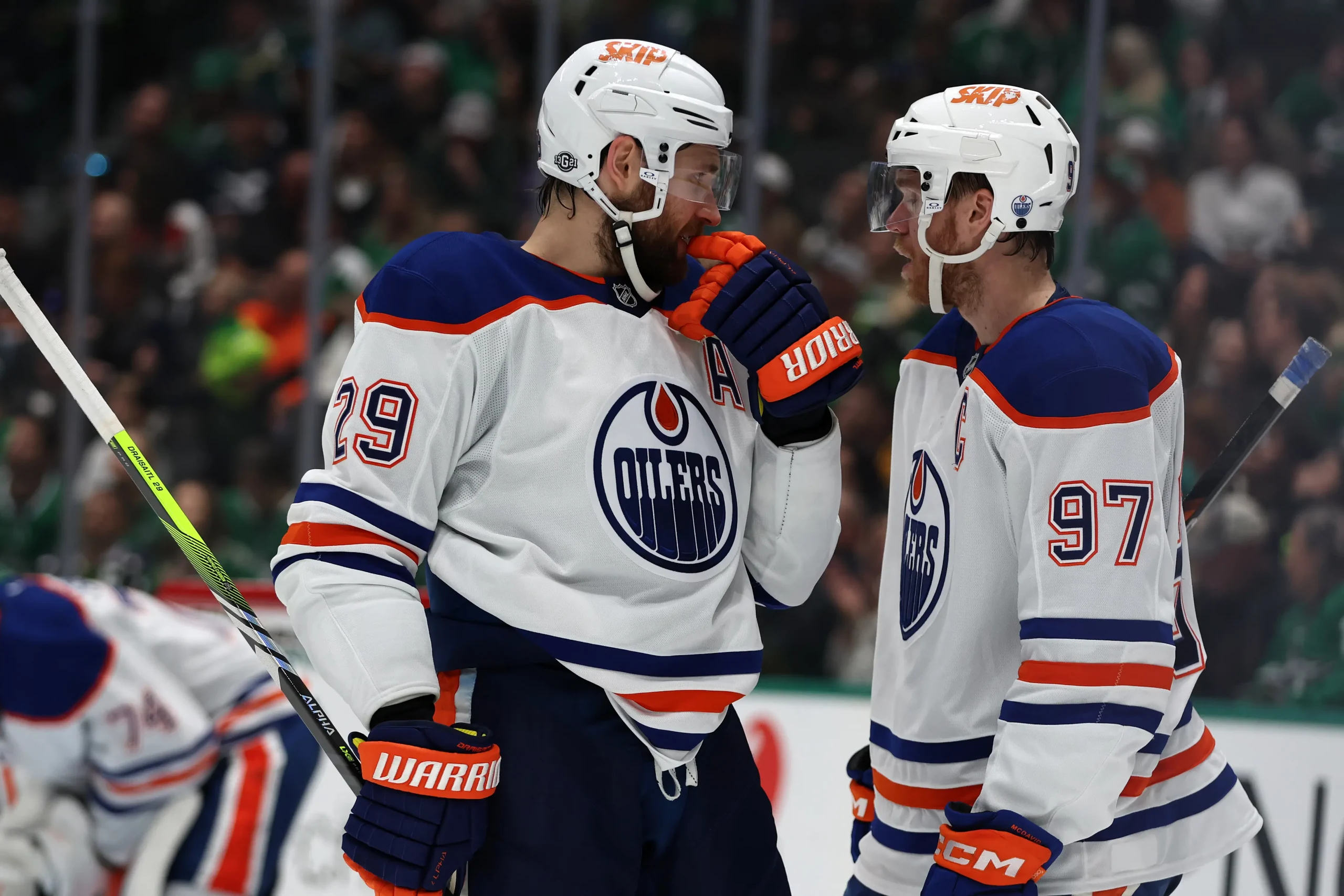 Watch: Connor McDavid, Leon Draisaitl bromance on display after stray puck hits Oilers bench