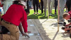Exclusive: Nick Saban’s last quarterback, Jalen Milroe, left his hand and footprints at Denny Chimes at the Alabama Captains Ceremony… Read More