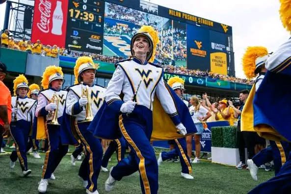 Mountaineer Miracle: WVU’s “Pride of West Virginia” Named Best Marching Band on Earth! With thunderous drums and soaring brass, the West Virginia University Marching Band has captured the world’s heart and claimed the top global honor. More than music, their performance is pure emotion — a breathtaking blend of unity, pride, and spirit. Every stride, every note echoes the strength of Mountaineer tradition. This isn’t just a win; it’s a celebration of a legacy that refuses to be silenced. West Virginia, the world is listening — and it’s moved… 